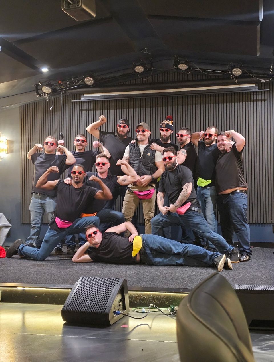 The band and crew together on stage