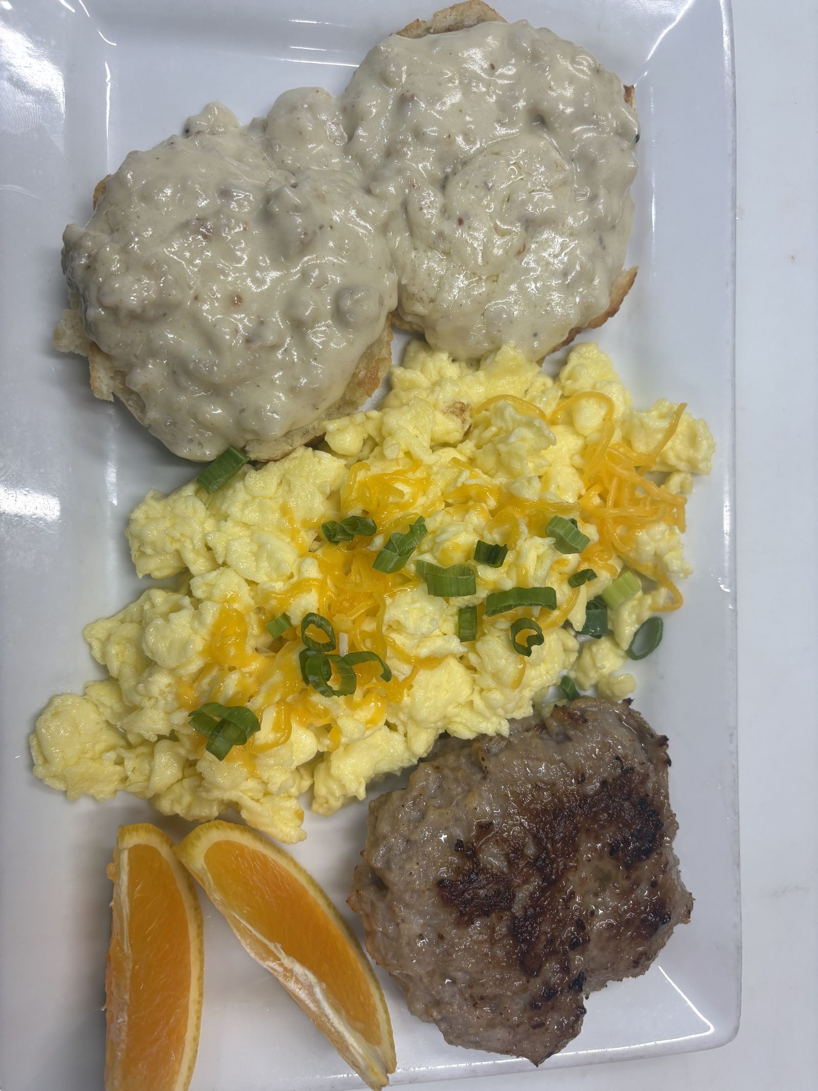 Biscuits and gravy with eggs at breakfast