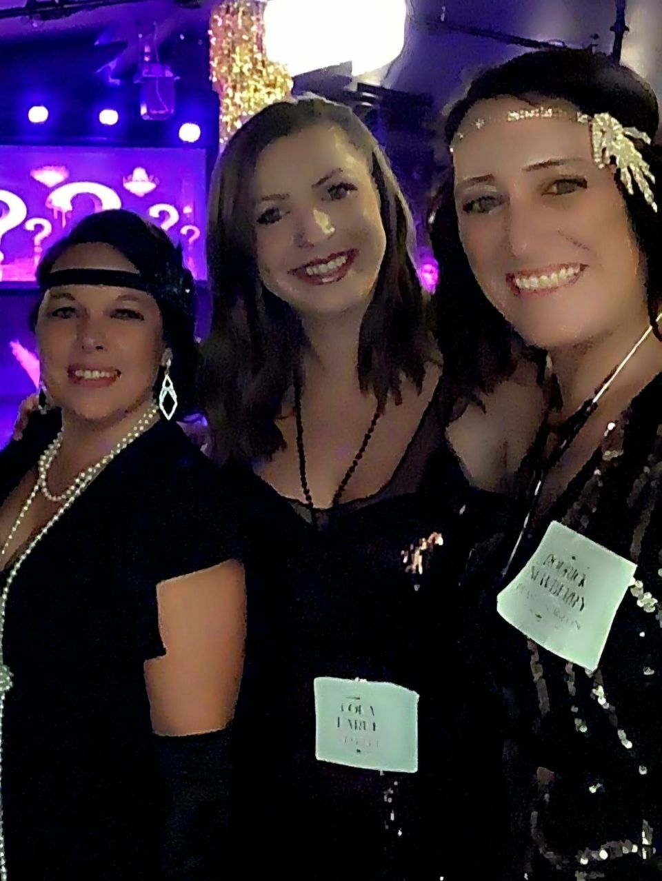 Three guests in flapper dresses at the murder mystery night
