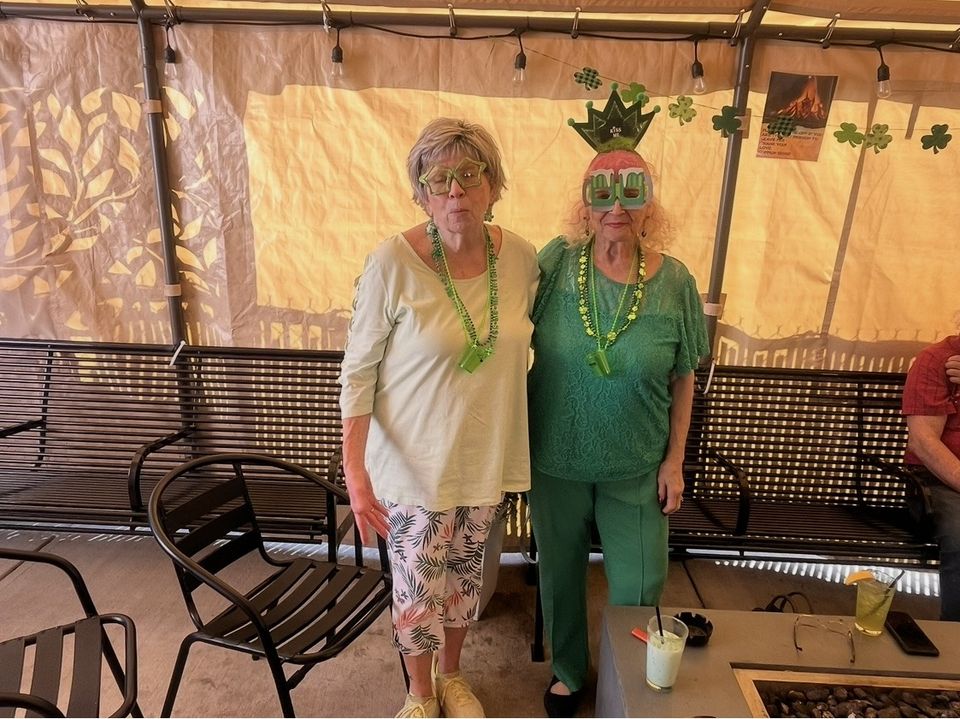 Guests in green on the patio for St. Patrick's Day